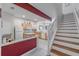 Open kitchen with light wood cabinets, white appliances, and a breakfast bar at 4904 Barnstead Dr, Riverview, FL 33578