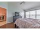 Main bedroom with lake view, king-size bed, and built-in dresser at 4904 Barnstead Dr, Riverview, FL 33578