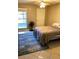 Comfortable bedroom with tiled floors and a ceiling fan at 5135 Gemstone Dr # 206, New Port Richey, FL 34652
