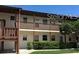 Two-story building with balconies and landscaping at 5135 Gemstone Dr # 206, New Port Richey, FL 34652