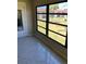 Bright sunroom featuring large windows and tile flooring at 5135 Gemstone Dr # 206, New Port Richey, FL 34652