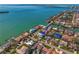 Wide aerial view showcases waterfront neighborhood and luxurious home, located next to the water at 6189 Leeland S St, St Petersburg, FL 33715