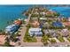 Aerial view of the waterfront home, showcasing lush surroundings, and neighborhood at 6189 Leeland S St, St Petersburg, FL 33715