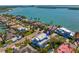 Aerial view showcasing the beautiful waterfront home with lush landscaping, and close proximity to bay at 6189 Leeland S St, St Petersburg, FL 33715