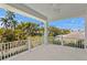 Spacious outdoor balcony offers a tranquil view of surrounding lush palm trees at 6189 Leeland S St, St Petersburg, FL 33715