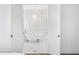 Luxurious bathroom showcasing a standalone tub, elegant chandelier, and marble floors at 6189 Leeland S St, St Petersburg, FL 33715