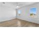 Bright bedroom with hardwood floors, large windows, and crown molding at 6189 Leeland S St, St Petersburg, FL 33715
