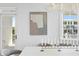 Stylish dining room features modern artwork, windows with outdoor views and seating for six at 6189 Leeland S St, St Petersburg, FL 33715