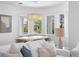 Bright dining room featuring a modern chandelier, large windows and seating for six guests at 6189 Leeland S St, St Petersburg, FL 33715