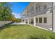 Spacious backyard with lush lawn, covered patio and sparkling swimming pool at 6189 Leeland S St, St Petersburg, FL 33715