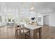 Kitchen island featuring a countertop and seating, with an open concept view to the dining and living rooms at 6189 Leeland S St, St Petersburg, FL 33715