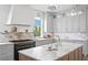 This spacious kitchen is complete with marble countertops and backsplash, and a large island at 6189 Leeland S St, St Petersburg, FL 33715