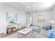 Spacious living area with modern decor, stylish console table, and comfortable seating arrangement at 6189 Leeland S St, St Petersburg, FL 33715