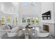Bright, airy living room with vaulted ceilings, fireplace, and seamless flow to the outdoors at 6189 Leeland S St, St Petersburg, FL 33715