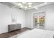 Well-lit primary bedroom featuring a decorative tray ceiling and balcony access at 6189 Leeland S St, St Petersburg, FL 33715