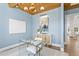 Comfortable home office features a glass desk, decorative lighting, and stylish decor at 6189 Leeland S St, St Petersburg, FL 33715