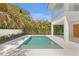 Inviting pool surrounded by lush landscaping, creating a private outdoor oasis at 6189 Leeland S St, St Petersburg, FL 33715