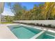 Stunning pool area with a spa, perfect for relaxation and outdoor entertainment at 6189 Leeland S St, St Petersburg, FL 33715