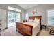 Main bedroom with sliding doors opening to a patio at 8109 Madrid Rd, Spring Hill, FL 34613