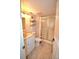 Clean bathroom, featuring a shower/tub combo, toilet and vanity with a marble top at 930 Virginia St # 201, Dunedin, FL 34698