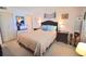 Bedroom with a double bed and dark brown dresser at 930 Virginia St # 201, Dunedin, FL 34698