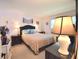 Bedroom with a double bed and nightstands with lamps at 930 Virginia St # 201, Dunedin, FL 34698