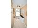 Bright entryway with tile flooring, storage, and access to exterior at 930 Virginia St # 201, Dunedin, FL 34698