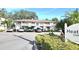 Heather Lake Condominiums building with parking and landscaping at 930 Virginia St # 201, Dunedin, FL 34698