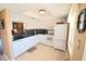 Well-equipped kitchen boasting white cabinets and granite countertops at 930 Virginia St # 201, Dunedin, FL 34698