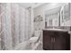 Clean bathroom with shower/tub combo and granite vanity at 9709 Pembrooke Pines Dr, Sun City Center, FL 33573