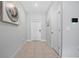 Bright and airy entryway with tile flooring and neutral walls at 9709 Pembrooke Pines Dr, Sun City Center, FL 33573