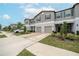 Two-story townhome with attached garage and landscaping at 9709 Pembrooke Pines Dr, Sun City Center, FL 33573