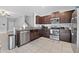 Modern kitchen with stainless steel appliances and granite countertops at 9709 Pembrooke Pines Dr, Sun City Center, FL 33573