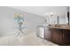 Modern kitchen with stainless steel appliances and granite countertops at 9709 Pembrooke Pines Dr, Sun City Center, FL 33573