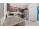 Kitchen with stainless steel appliances and granite countertops at 9709 Pembrooke Pines Dr, Sun City Center, FL 33573