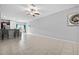 Open concept living room with tile floors and kitchen at 9709 Pembrooke Pines Dr, Sun City Center, FL 33573