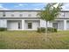 Private patio with access to a grassy backyard at 9709 Pembrooke Pines Dr, Sun City Center, FL 33573