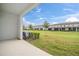 Covered patio overlooking the community green space at 9709 Pembrooke Pines Dr, Sun City Center, FL 33573