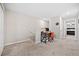 Upstairs hallway with carpeted floor and view of bedroom at 9709 Pembrooke Pines Dr, Sun City Center, FL 33573