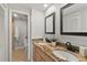 Bathroom featuring double vanity with granite countertop and modern fixtures at 100 Pierce St # 1210, Clearwater, FL 33756