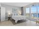 Bright bedroom with water views, white bedding, and coastal decor at 100 Pierce St # 1210, Clearwater, FL 33756