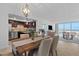 Bright dining room with open concept kitchen and water views at 100 Pierce St # 1210, Clearwater, FL 33756