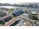 Aerial view showing building, pool, tennis court at 10216 Regal Dr # 603, Largo, FL 33774