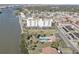 Aerial view showing building, pool, tennis court at 10216 Regal Dr # 603, Largo, FL 33774