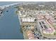 Aerial view showcasing building, pool, and tennis court at 10216 Regal Dr # 603, Largo, FL 33774