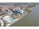 Aerial view showing building, pool, tennis court at 10216 Regal Dr # 603, Largo, FL 33774