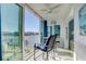 Relaxing balcony overlooking the water with outdoor seating at 10216 Regal Dr # 603, Largo, FL 33774