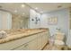 Bathroom with granite countertops and double sinks at 10216 Regal Dr # 603, Largo, FL 33774