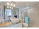 Updated bathroom with granite countertops, dual sinks, and a walk-in shower at 10216 Regal Dr # 603, Largo, FL 33774