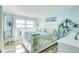 Main bedroom featuring a king-size bed and ocean view at 10216 Regal Dr # 603, Largo, FL 33774